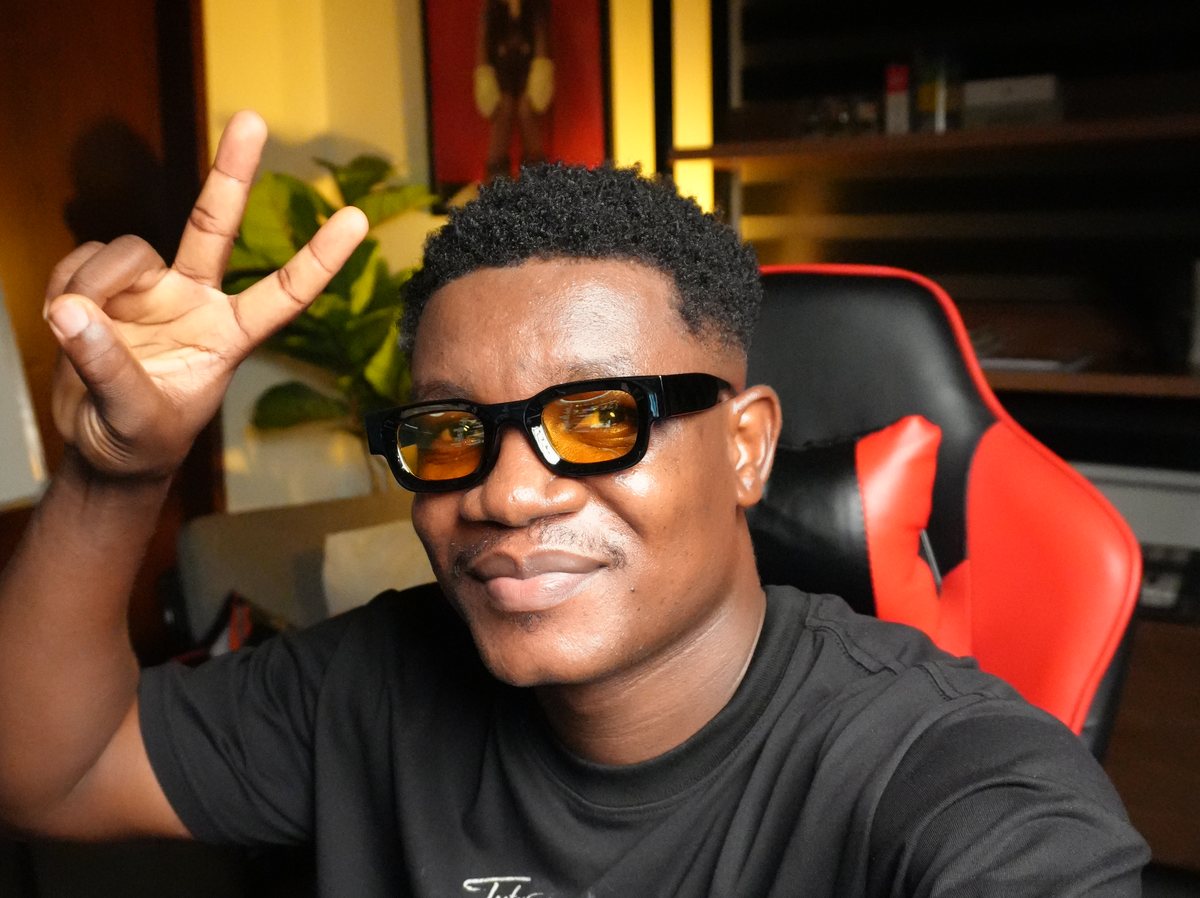 Michael Eneji at his desk